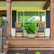 Two rocking chairs side by side on a front porch in Grottoes, VA.