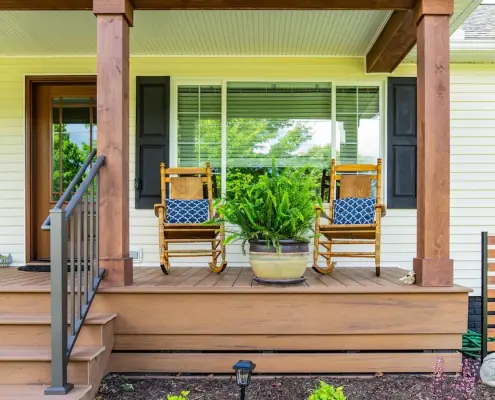 Two rocking chairs side by side on a front porch in Grottoes, VA.