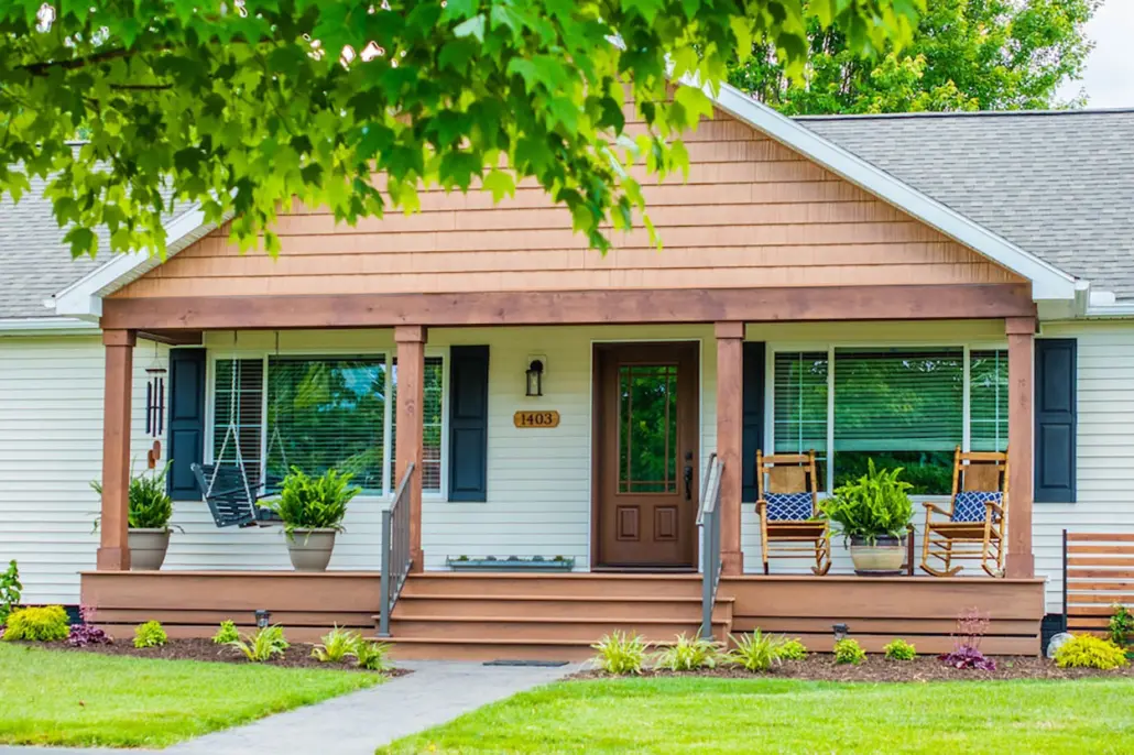 Covered front porch with wood-look fiberglass front door