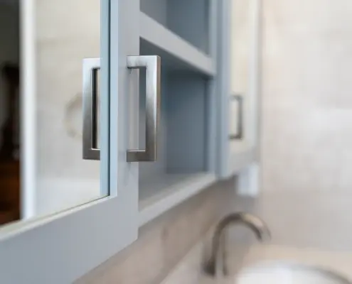 Custom cabinetry and close up of hardware in a spa-worthy bathroom renovation.