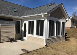 Custom sunroom with vinyl siding