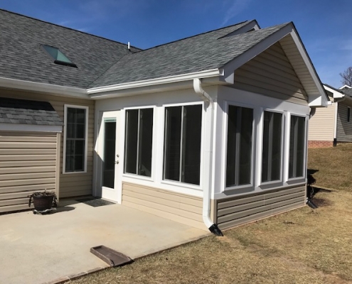 Custom sunroom with vinyl siding