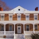 full front of house featuring white gingerbread trim