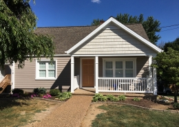 front porch with siding and trim