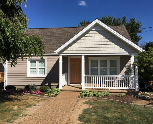 front porch with siding and trim