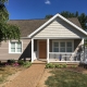 front porch with siding and trim