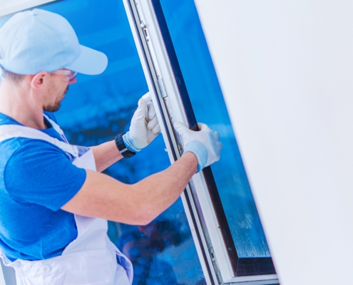 Worker installing a new window