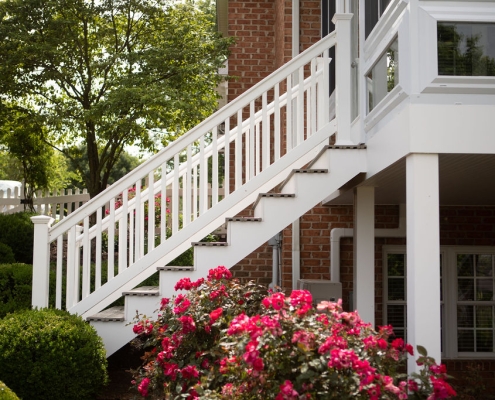 Sunroom stairs from the exterior of a house.