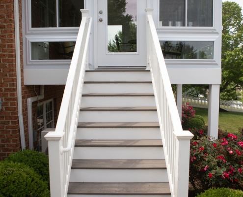 Exterior stairs leading to the deck and sunroom.