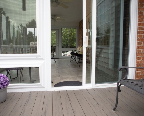 Deck adjoining sunroom.