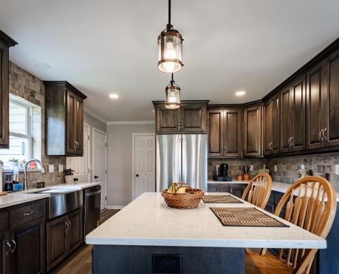 Rockingham kitchen after a kitchen remodel with dark cabinets and stainless steel appliances.