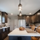 Rockingham kitchen after a kitchen remodel with dark cabinets and stainless steel appliances.